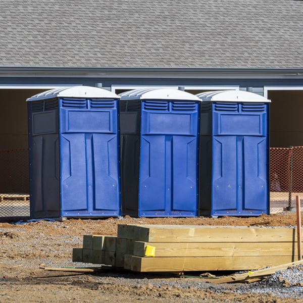 what is the cost difference between standard and deluxe portable restroom rentals in Crown Point